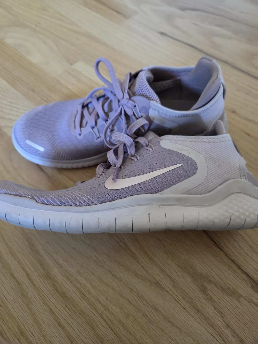 Nike Women's Pink Lilac Athletic Running Sneakers with White Swoosh